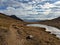 On the Maienfelder Furgga with a beautiful small mountain lake. Hiking in autumn between Davos and Arosa.