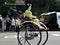 Maiko girl riding in a rickshaw, Kyoto Japan.