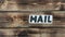 Mail inscription and wooden background
