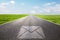 Mail, message symbol on long straight road, highway.