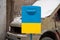 A mailbox in the color of the yellow-blue flag of Ukraine stands in the center of the city of Dnipro in Ukraine, the