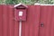 Mailbox with owl pattern on the gate of the house