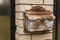 Mailbox of a private house, a mailbox made of black metal installed on a brick fence of a private residential house