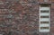 Mailbox slots on a industrial red brick wall background an old fashioned building