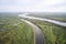 The main channel and meander of the river. Swampy floodplain. Shooting from a drone