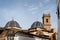 The main church `San Roque` with blue tiled domes and tower from the 18th century in Oliva, Spain