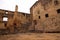 The main courtyard of the castle surrounded by ruins of buildings and castle walls. Landstejn Castle