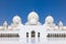 The main courtyard of the Sheik Zayed grand mosque in Abu Dhabi with the prayer hall and its round domes