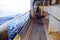 Main deck of container vessel during sailing through calm sea.