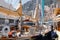 A main deck of sail yacht in classic style, lot of huge yachts are in port of Monaco at sunny day, Monte Carlo