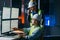 Main engineer and workers operator wearing safety vests and hard hats control product process on factory uses SCADA system