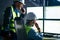 Main engineer and workers operator wearing safety vests and hard hats control product process on factory uses SCADA system