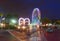 Main entrance of Old Town with arches and colorful wheel in Kissimmee area.