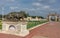 Main Gate and Lioness statue in garden of Mysore Palace.