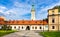 Main gate to Palace of Habsburgs, Old Castle and Zywiec Castle Park with Cathedral tower in Zywiec in Poland