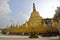 Main giant stupa of Shwemawdaw Pagoda at Bago, Myanmar with sacred praying altar, god statue & offerings