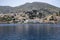 Main Harbor of Symi Island Greece with Colorful Houses on the Mountain Side