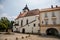 Main Husovo Square, colorful houses on sunny day, renaissance and baroque historical buildings, arcade, Church of the Holy Trinity