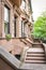 Main ladder and entry door. New york Harlem buildings. Brown houses. NYC, USA