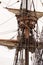 main mast of historic ship with crow`s next and rigging