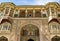 The main palace in the ancient Amber Fort and its front gate - Ganesh Pol, Jaipur, India