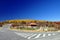 Main road and small cottage with autumn colors