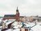 Main Square In Krakow, Poland Surrounded By Historic Townhouses And Churches