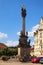 Main square of medieval Loket city with ancient Plague Column by summer day.