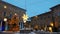 Main square of Urbino decorated with christmas tree and stars with snow at dusk