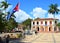 Main square of Vinales village with church and cuban flag