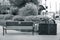 Main Street Bench with trash and recyle can close by in black & white