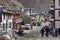 The main street of the city of Jomsom with offices, shops, transport and residents at the foot of the Himalayan Mountains in Nepal