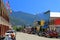 Main Street of Kaslo on Kootenay Lake with Purcell Mountains on Hot Summer Day, British Columbia, Canada