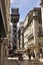 A main street in Portugal with famous escalator.