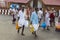 In the main street, Unidentified Hindu pilgrims people ready to go to the temple by walking, after the bath at the gate. Great tim