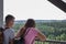 The main subject is out of focus, lookout tower young couple stand look date boy girl summer closeup view tourism travel