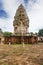 Main tower and courtyard of ancient Khmer temple built of red sandstone and laterite and dedicated to the Hindu god Shiva