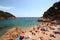 Main view of crowdy beach of Tamariu, Costa Brava, Catalonia, Spain