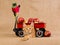 Maine Coon kitten with red wagon and apples