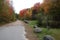 Maine country road in autumn with boulders