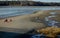 Maine island at low tide in winter sunny day