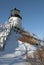 Maine Lighthouse On Snow Covered Cliff