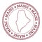 Maine round rubber stamp with us state map.