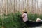 Maing Thauk, Myanmar - April 2019: Burmese woman picking tomatos in the floating garden