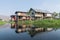 Maing Thauk, Myanmar - April 2019: traditional Burmese floating house on water in Inle lake