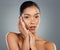 Maintaining a healthy skincare routine. a beautiful young woman posing against a grey background.