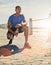 Maintaining his perfect form. a young sporty man crouching outside.