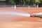 Maintenance of clay tennis court. Service and preparation of the court. Close up. Copy space