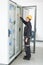 Maintenance engineer testing voltage switchgear and bay control