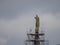 Maintenance, restoration of old Jesus statue, scaffolding on church